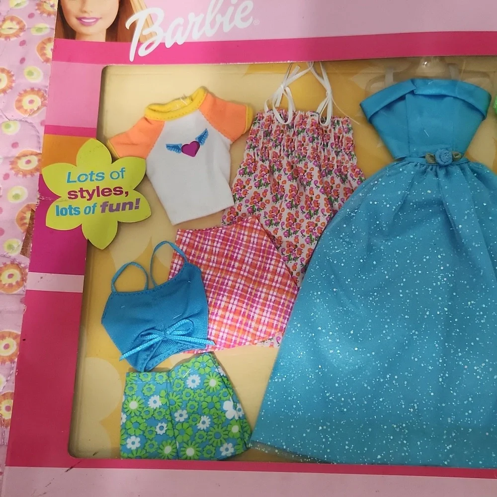 Brand New never opened Barbie fashions.